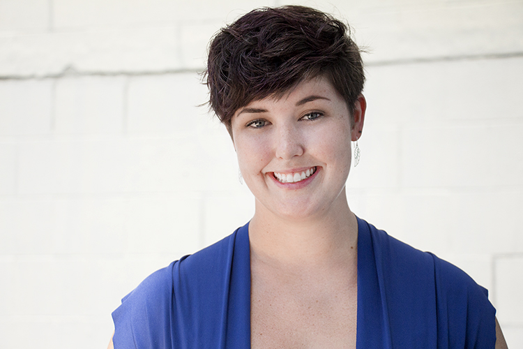 Woman with short hair smiles brightly 