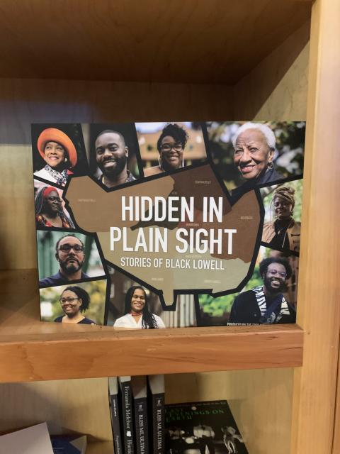 A book on a shelf. The title: "Hidden in Plain Sight: Stories of Black Lowell."
