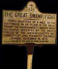 A sign or placard for "The Great Swamp."