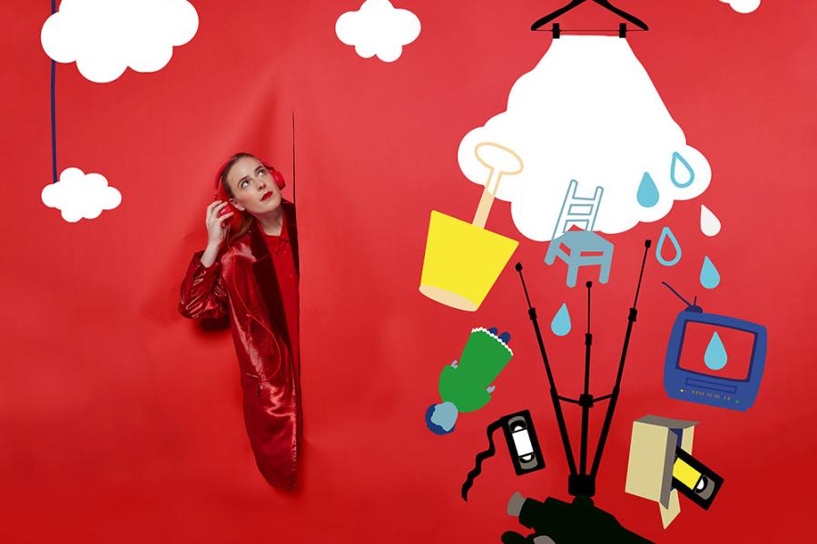 Is It Thursday Yet? poster features the title and Jenn, in all red, leaning out of a red backdrop with a dress as a cloud where electronics dangle from it.