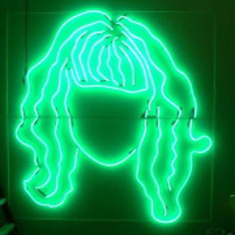 A neon sign illustration of a female with long hair and bangs.